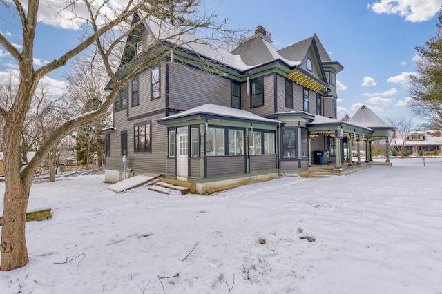 view of front of home featuring a sunroom