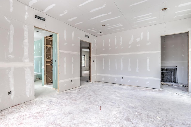 unfurnished living room featuring a fireplace