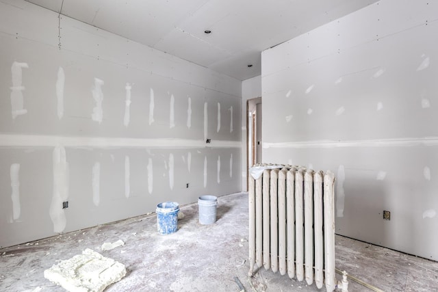 empty room featuring radiator