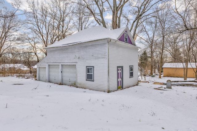 view of snow covered garage