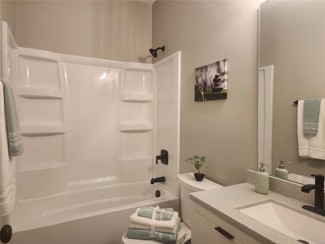 full bathroom featuring vanity, washtub / shower combination, and toilet