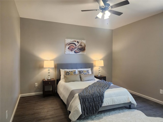 bedroom with ceiling fan and dark hardwood / wood-style flooring