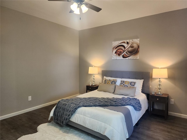 bedroom featuring ceiling fan and dark hardwood / wood-style floors