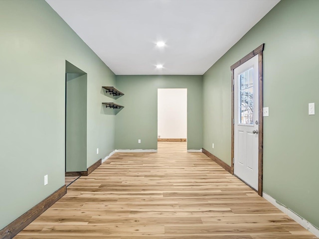 empty room with light hardwood / wood-style floors