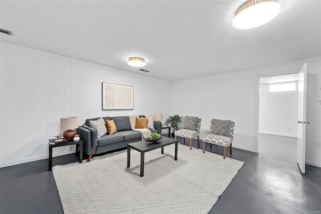 living room featuring concrete flooring