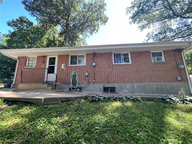 back of property featuring a patio