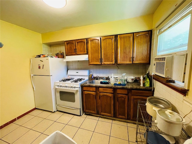 kitchen with white appliances, cooling unit, decorative backsplash, sink, and light tile patterned flooring