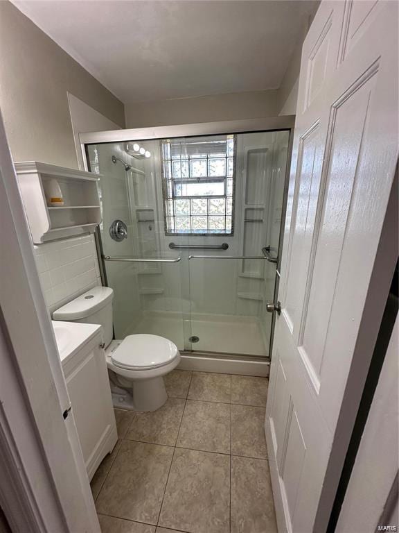 bathroom featuring an enclosed shower, tile patterned floors, vanity, decorative backsplash, and toilet