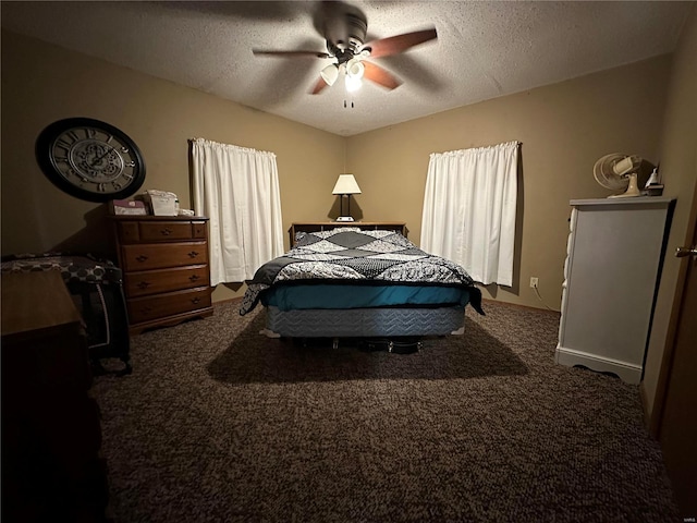 carpeted bedroom with ceiling fan and a textured ceiling