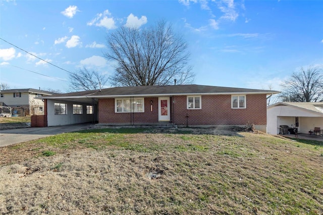 ranch-style home with a carport and a front yard