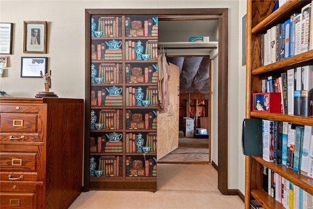 interior space featuring light carpet and wooden walls