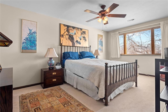 bedroom featuring ceiling fan and light colored carpet