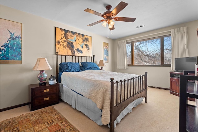 bedroom featuring ceiling fan and light colored carpet