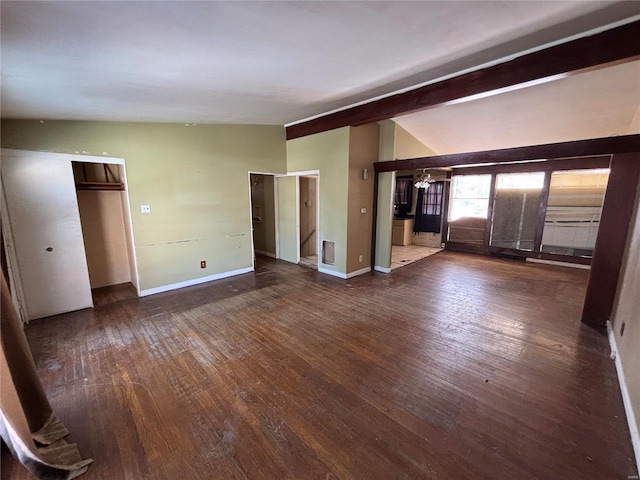 interior space featuring dark hardwood / wood-style floors and lofted ceiling with beams