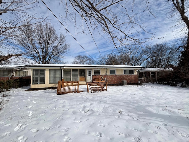 view of snow covered house