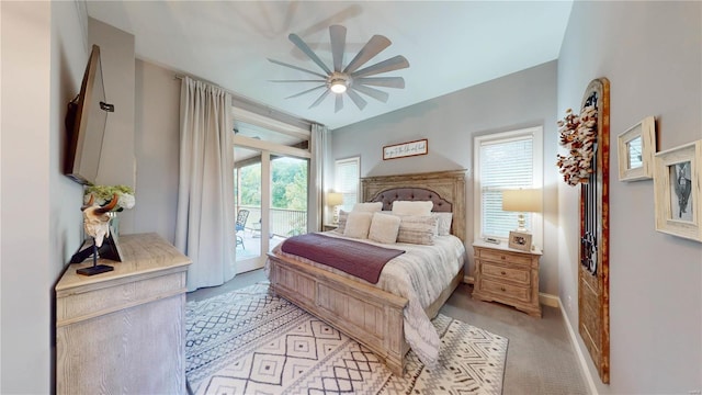 bedroom featuring light carpet, ceiling fan, and access to outside