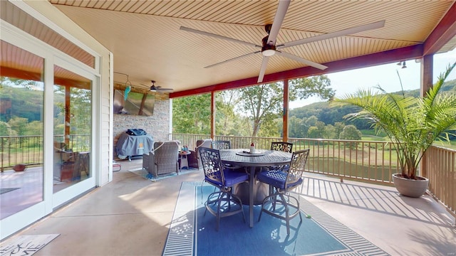 view of patio with grilling area and ceiling fan