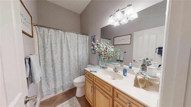 bathroom with toilet, vanity, tile patterned flooring, and a chandelier