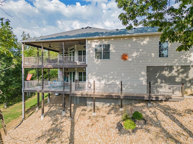 rear view of house with ceiling fan and a deck