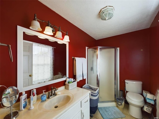 bathroom with a textured ceiling, an enclosed shower, tile patterned flooring, vanity, and toilet