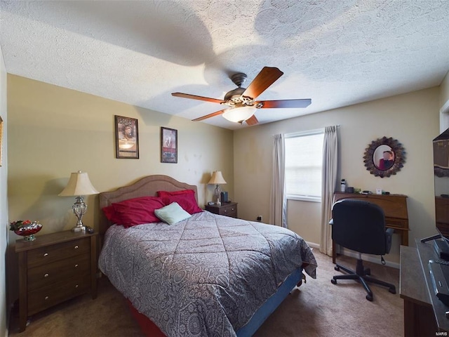 bedroom with ceiling fan, a textured ceiling, and carpet floors