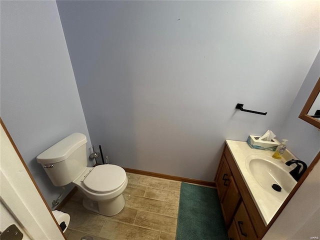 bathroom with toilet and vanity