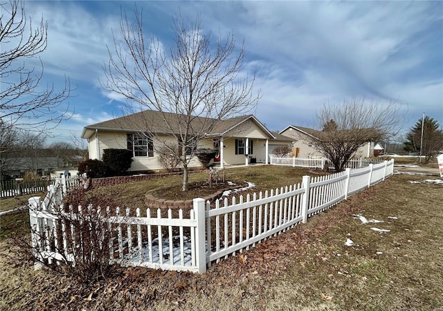 ranch-style house with a fenced front yard