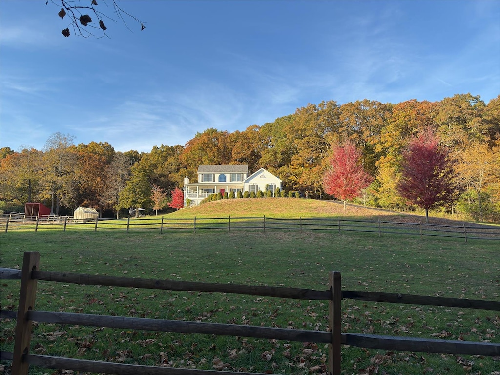 view of yard with a rural view