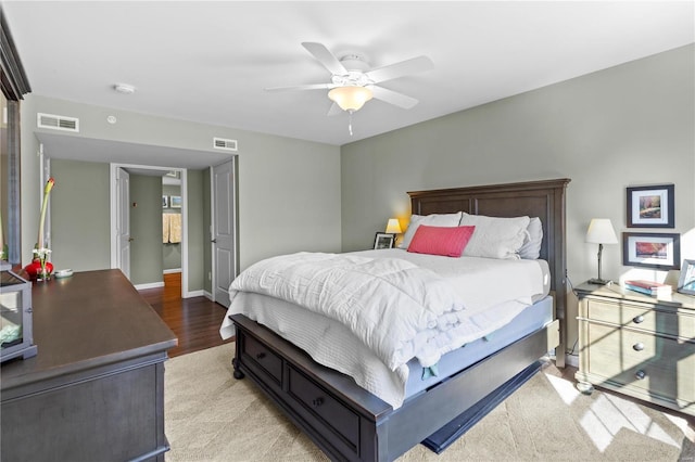 bedroom with ceiling fan and light hardwood / wood-style flooring