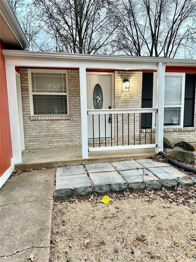 doorway to property with covered porch