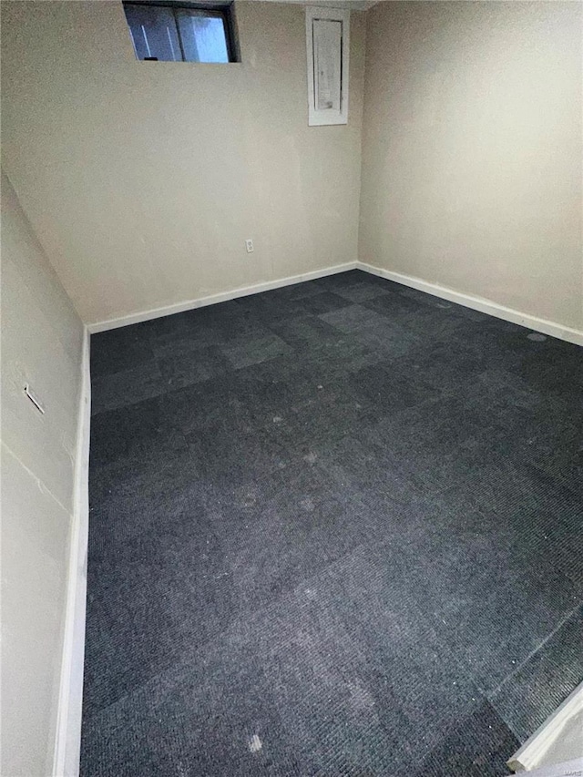 basement with dark carpet