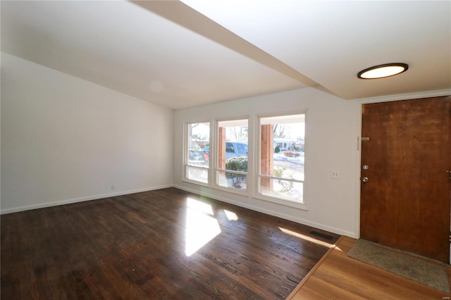 foyer with dark hardwood / wood-style flooring