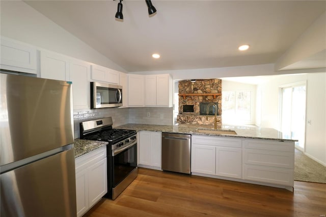 kitchen featuring white cabinets, appliances with stainless steel finishes, and sink