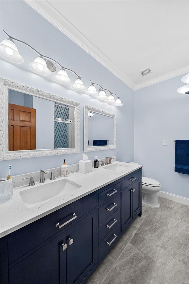 bathroom with ornamental molding, toilet, and vanity