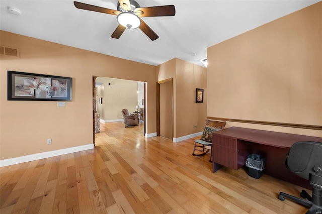 home office with ceiling fan and light wood-type flooring