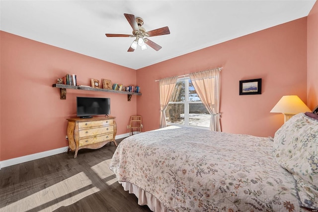 bedroom with dark hardwood / wood-style floors and ceiling fan