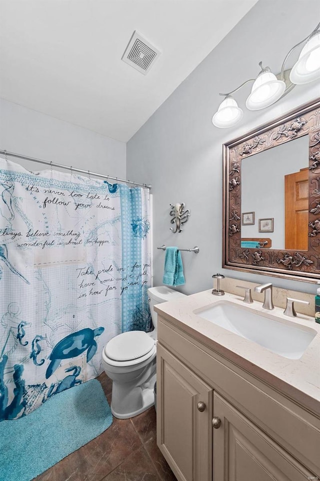 bathroom with vanity, a shower with curtain, vaulted ceiling, and toilet