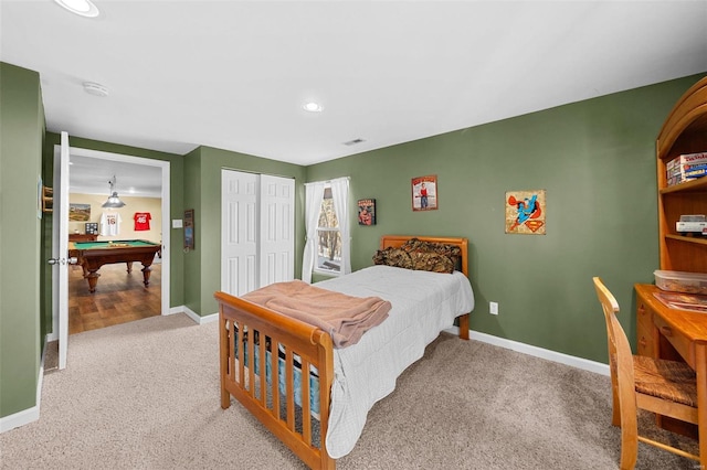 carpeted bedroom featuring billiards and a closet