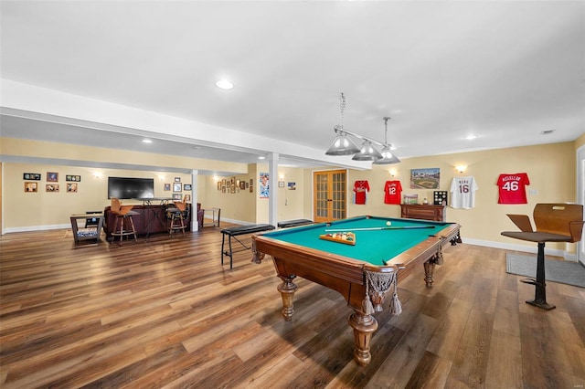 rec room with hardwood / wood-style flooring, indoor bar, and pool table