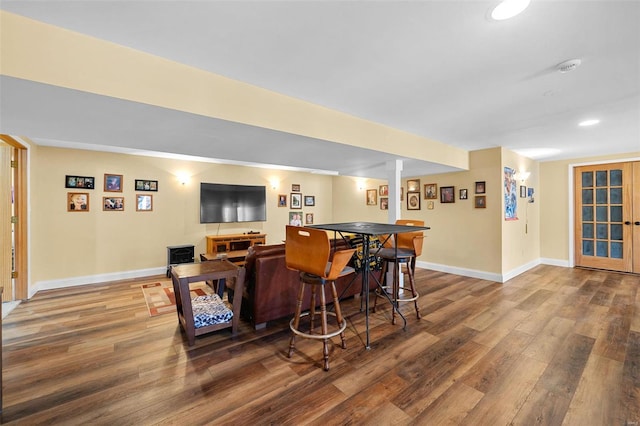 bar featuring dark wood-type flooring