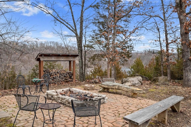 view of patio with an outdoor fire pit