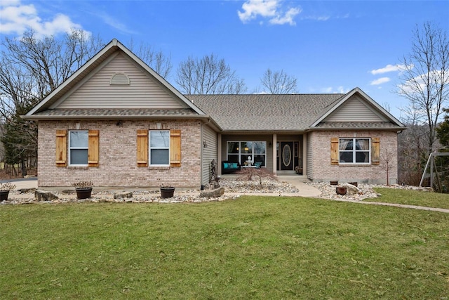 rear view of house with a yard