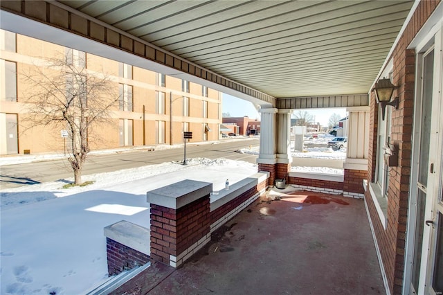 view of snow covered patio