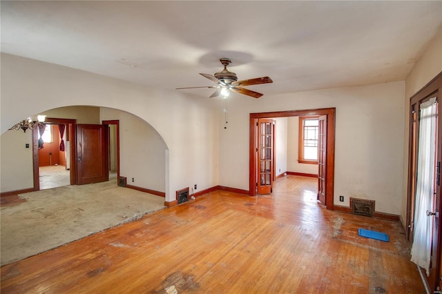 spare room featuring ceiling fan and hardwood / wood-style floors