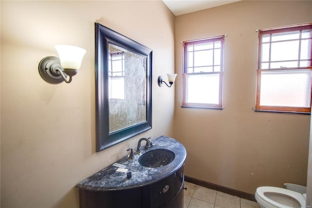 bathroom with tile patterned floors, vanity, and toilet