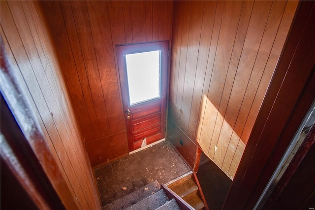 interior space featuring wood walls