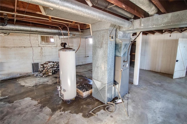 basement featuring heating unit and water heater