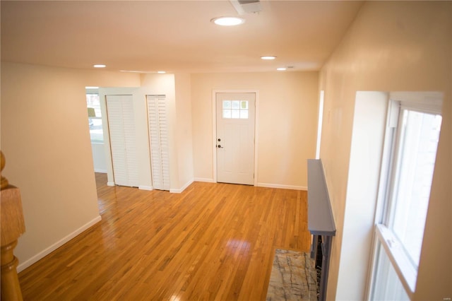 foyer entrance with light hardwood / wood-style flooring