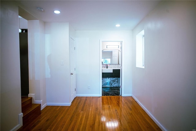 hall with dark hardwood / wood-style flooring