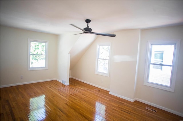 additional living space featuring ceiling fan and hardwood / wood-style floors